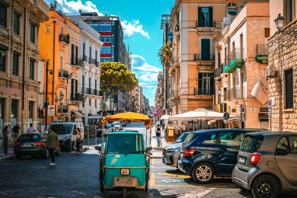 Street with people and cars in Bari Italy