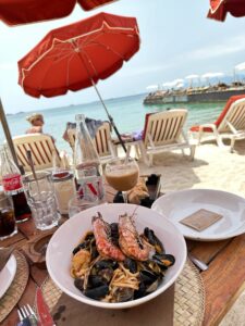 Seafood pasta with shrimp and mussels at a beachside restaurant in Antibes, France.