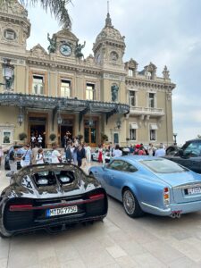 Luxurious Bugatti and classic Italian cars outside Monte Carlo Casino in Monaco.