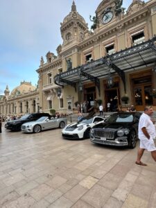 Luxury cars parked outside Monte Carlo Casino in Monaco.