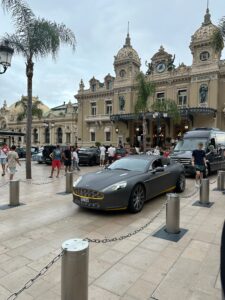 Luxury sports car parked at the historic casino in Monte Carlo.