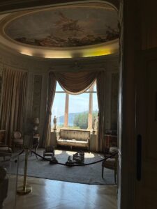 Lavish historic palace interior with large window and ornate ceiling fresco. Villa Ephrussi de Rothschild in Saint Jean Cap Farrat