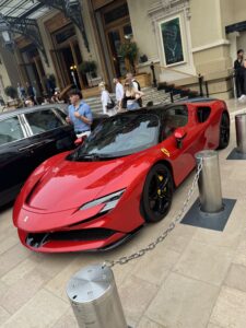 Luxurious red Ferrari sports car on display outside Monte Carlo in Monaco.