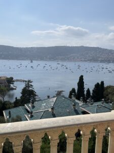 Villa Ephrussi de Rothschild in Saint Jean Cap Farrat overlooking marina and luxury yachts, scenic seaside view, hillside homes.