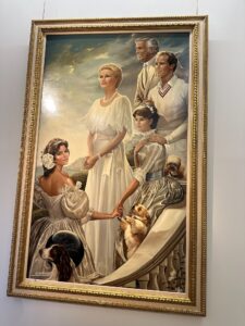 Elegant family portrait of Princess Grace, Prince Rainer III, and there children hanging in the Prince's palace in Monaco.