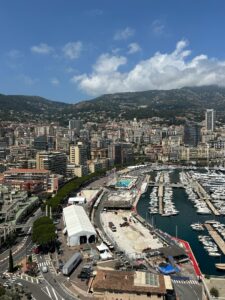 Vibrant harbor scene with yachts and city skyline in Monte Carlo, Monaco.